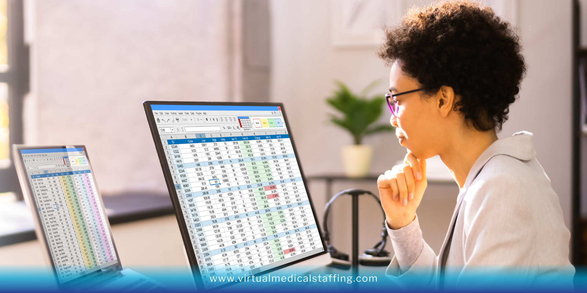 Remote executive assistant analyzing data on dual monitors with spreadsheets in modern home office